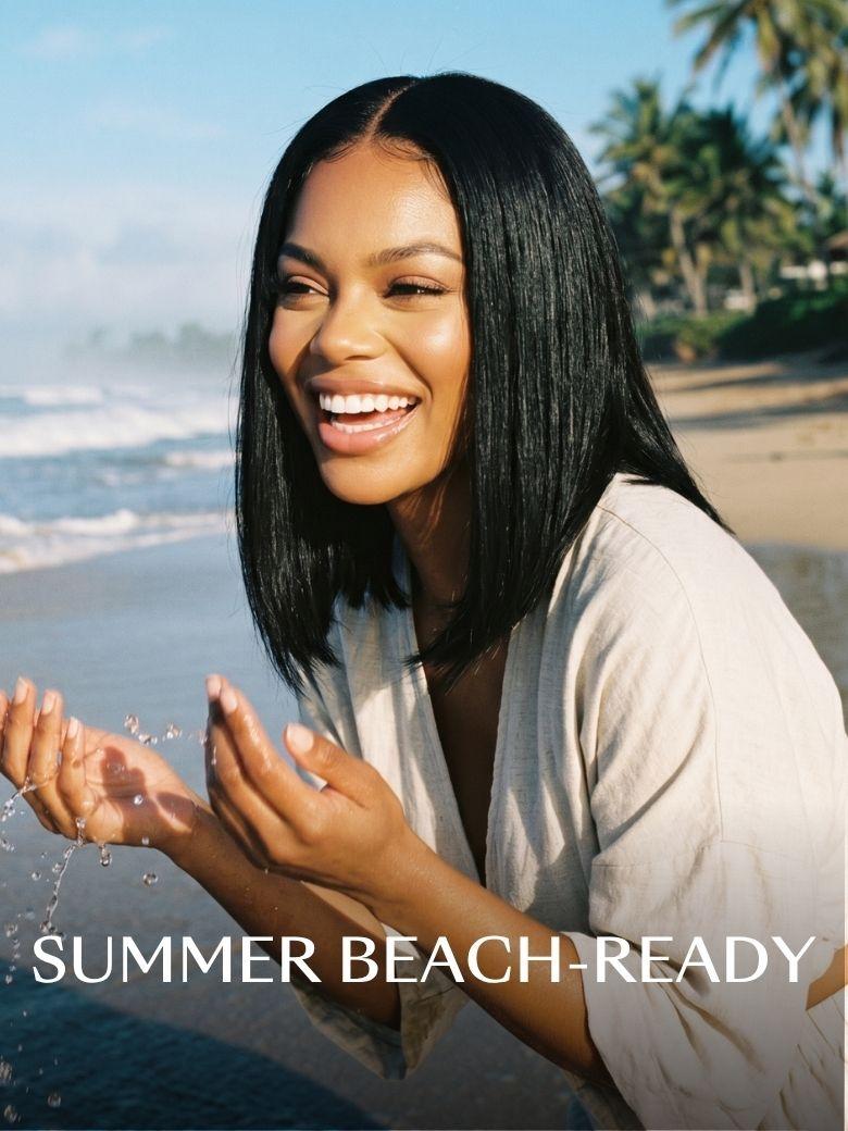 Model wearing a sleek black yaki straight bob wig on a beach, showcasing a realistic summer lifestyle look.