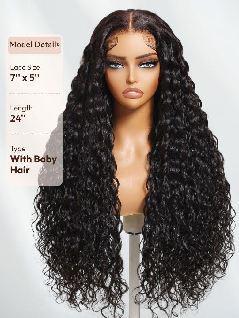 A 24-inch dark wig with tight, voluminous curls is displayed on a stand. Fine baby hairs and a sheer lace front create a realistic, soft-looking hairline.